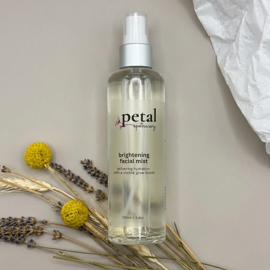 Bottle of petal brightening facial mist with flowers and herbs on a neutral background
